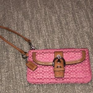 Pink Coach wristlet in signature canvas